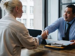 Develop soft skills ethnic businessman shaking hand of applicant in office